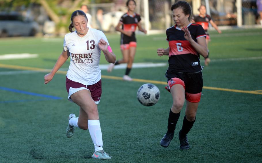 McKenzie Steele kicks the ball.