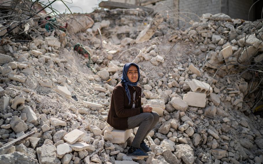Mezyan, 12, is the only quake survivor from her immediate family, whose third-floor apartment crumbled in Jinderis, Syria. The girl has been taken in by members of her extended family.