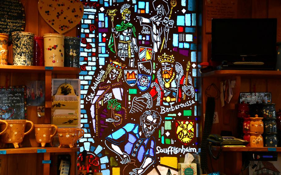 A stained glass window featuring key moments in the history of the pottery tradition in the village of Soufflenheim, France, has pride of place in the Ignace Friedmann pottery store and workshop. Soufflenheim has been a hub of Alsatian pottery manufacturing since the 12th century, when Emperor Frederick I, also known as “Red Beard” or Barbarossa, granted residents the right in perpetuity to extract and use the clay found in the nearby Hagenau Forest.