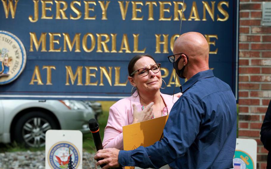 Tonya Monture looks on at her husband Robert Montuore after he spoke about her father, Howard Conyack Sr., who died at the Menlo Park veterans home, during a rally in September 2016.