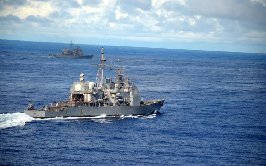The guided-missile cruiser USS Robert Smalls sails in formation during a multi-carrier exercise in the Philippine Sea, Monday, Nov. 6, 2023. 