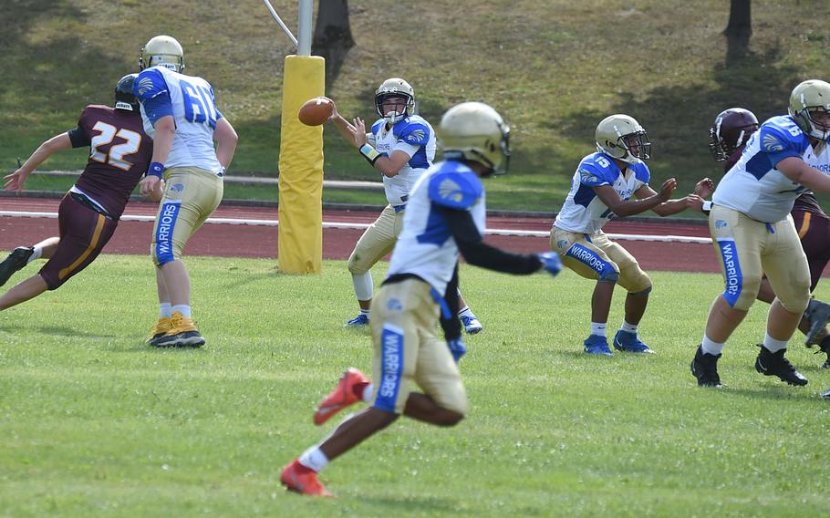 Wiesbaden Warriors’ quarterback Logan Hall looks to find open receivers before throwing the ball down field. 