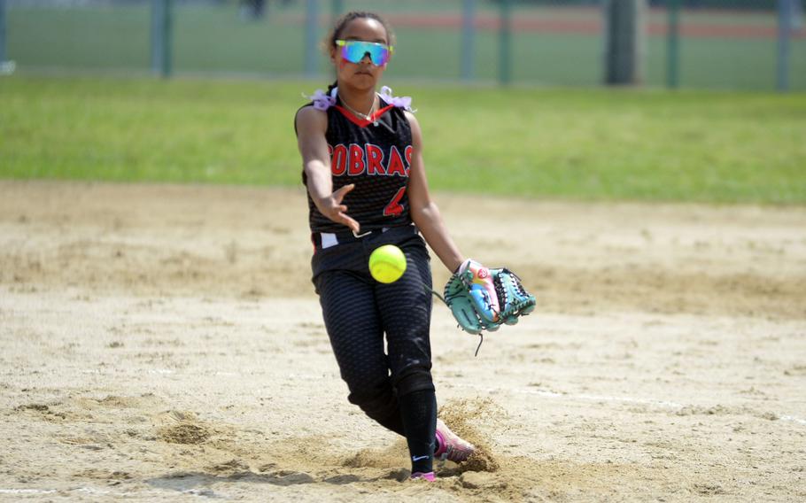 Miu Best hurls the ball toward home.