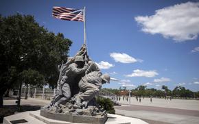 A smaller scale replica of the Marine Corps War Memorial statue stands near the parade ground at the Marine Corps Recruiting Depot, Wednesday, May 11, 2022, in Parris Island, S.C. The threat of rising seas is encroaching upon one of America's most storied military installations, where thousands of recruits are molded into Marines each year. (AP Photo/Stephen B. Morton)