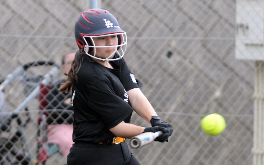 Kadena’s Nao Grove connects for a three-run inside-the-park home run against Kubasaki during Tuesday’s DODEA-Okinawa softball game. The Panthers won 4-1 and took a 3-0 season-series lead over the Dragons.