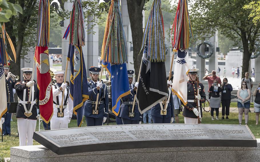 The Armed Forces Color Guard stands during the playing of the national anthem at the National World War II Memorial in Washington, D.C., on the 79th anniversary of the start of the D-Day invasion, Tuesday, June 6, 2023. In the foreground is the new FDR prayer plaque.