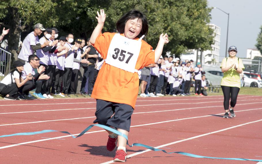 Soyo Kubota, of Tokyo, takes first place in the 50-meter dash during the Kanto Plains Special Olympics at Yokota Air Base, Japan, Saturday, Nov. 4, 2023.