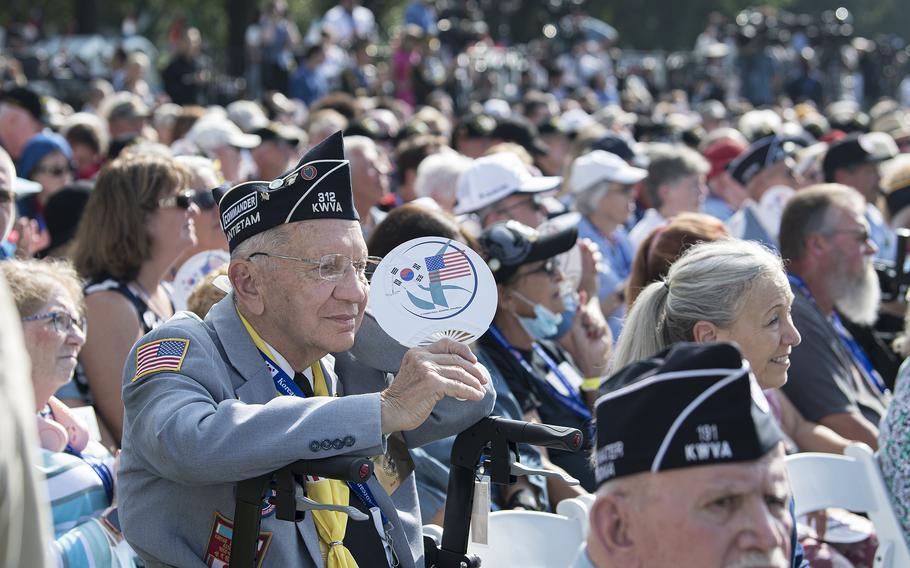 Korean War veteran Ron Twentey, from Hagerstown, Md., fans himself during a ceremony to dedicate the Wall of Remembrance addition to the Korean War Memorial on the National Mall in Washington, D.C. on Wednesday, July 27, 2022.