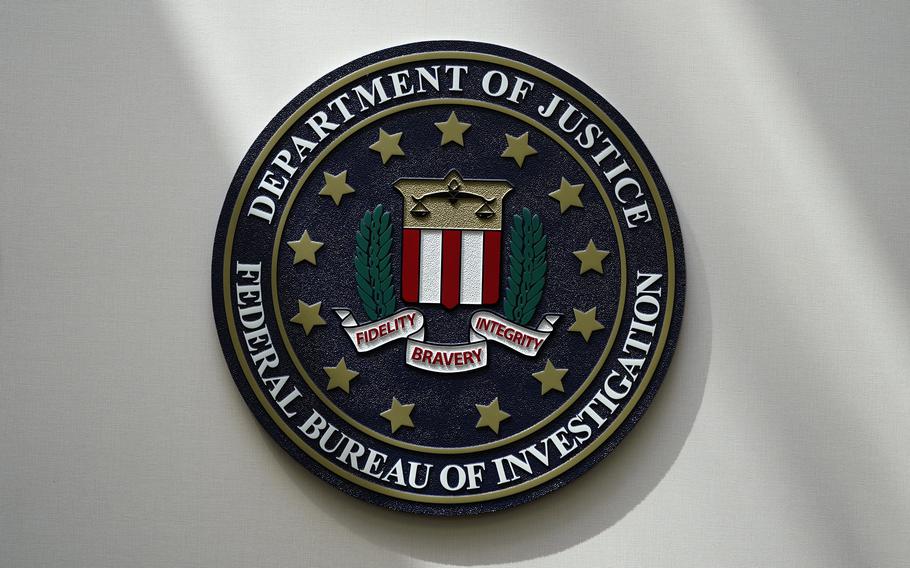 The FBI seal is pictured in Omaha, Neb., Aug. 10, 2022. FBI officials repeatedly violated their own standards when they searched a vast repository of foreign intelligence for information related to the insurrection at the U.S. Capitol on Jan. 6, 2021, and racial justice protests in 2020. That’s according to a heavily blacked-out court order released Friday, May 19, 2023. FBI officials said the violations predated a series of corrective measures that started in the summer of 2021 and continued last year.