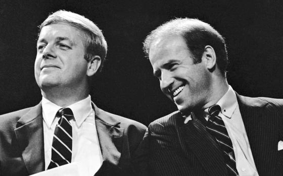 Maine Gov. Joseph Brennan, left, enjoys a laugh with U.S. Sen. Joseph Biden of Delaware during the opening ceremonies at Maine's Democratic presidential straw poll in Augusta, Maine, Friday, Sept. 30, 1983. Brennan, whose hardscrabble childhood shaped his working class views in a political career that included two terms as governor and two terms in the US. House, died Friday evening, April 5, 2024, at his home in Portland, Maine. He was 89.
