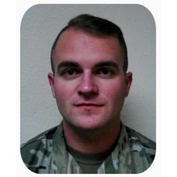 Photo of Spc. Taylor Adam Lee in uniform from the shoulders up.