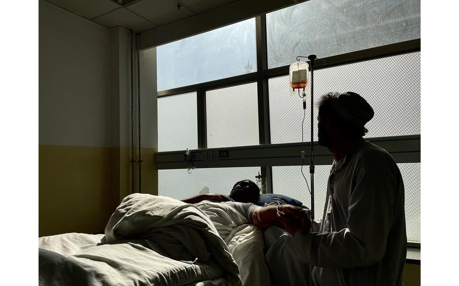 A nurse attends to a patient in Kabul's Jumhuriat hospital's emergency ward that has run out of critical supplies like dressings and insulin following the near halt in aid to Afghanistan. 