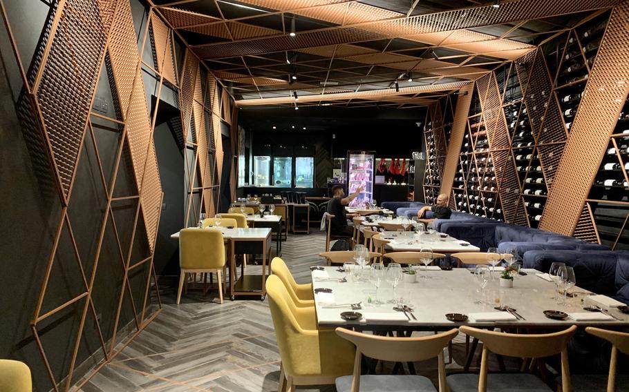 Mood Steakhouse and Garden Bar in Salerno, Italy offers indoor and garden seating. The indoor dining room includes a wine cellar and semi-private dining area. 