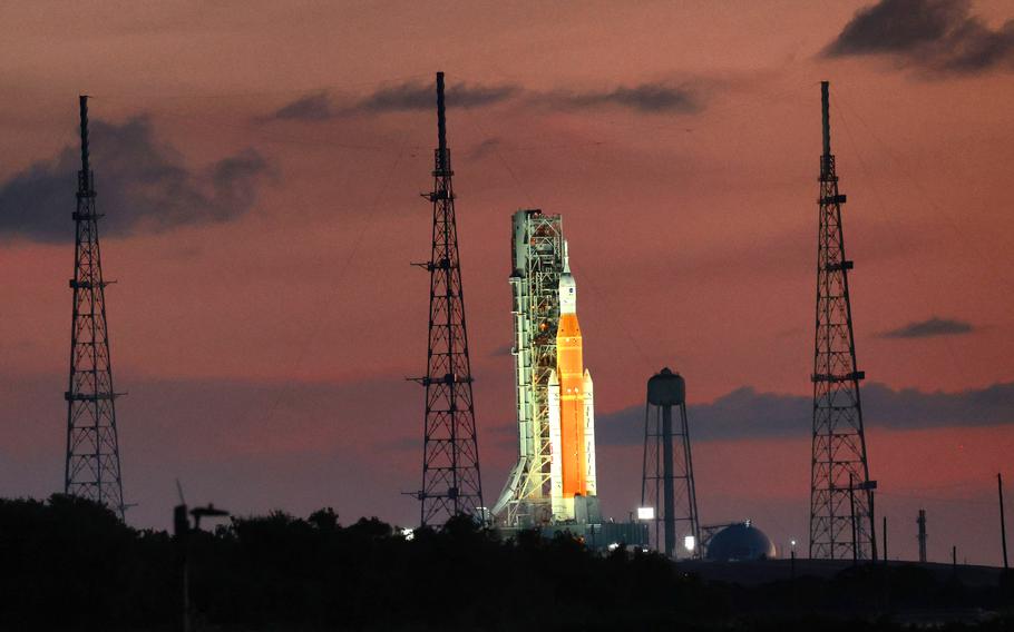 The sun rises behind Artemis I, NASAs heavy-lift lunar rocket system, as it sits temporarily grounded at pad 39-B at Kennedy Space Center, Fla., Tuesday, Sept. 6, 2022, after the scrub of the second launch attempt Saturday. 