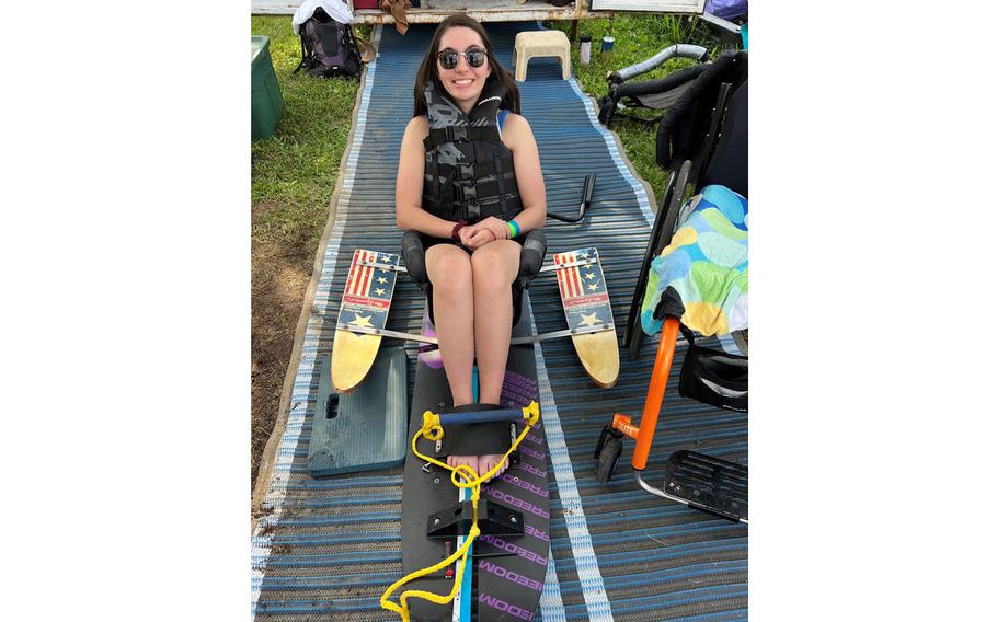 Lauren Arduser, a quadripalegic, uses a adaptive aid to water ski. She’s set to ski down snowy slopes in Colorado at the 2023 National Disabled Veterans Winter Sports Clinic.