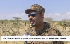 In this image made from undated subtitled video released by the prime minister of Ethiopia, Abiy Ahmed is seen dressed in military uniform speaking to a television camera at an unidentified location in Ethiopia. A state-affiliated broadcaster and the prime minister's Twitter account on Friday, Nov. 26, 2021 showed video of Abiy purportedly on the battlefront of the country's yearlong war against Tigray forces, four days after he announced he would direct the army from there. (Prime Minister of Ethiopia via AP)