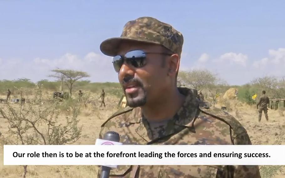In this image made from undated subtitled video released by the prime minister of Ethiopia, Abiy Ahmed is seen dressed in military uniform speaking to a television camera at an unidentified location in Ethiopia. A state-affiliated broadcaster and the prime minister’s Twitter account on Friday, Nov. 26, 2021 showed video of Abiy purportedly on the battlefront of the country’s yearlong war against Tigray forces, four days after he announced he would direct the army from there.