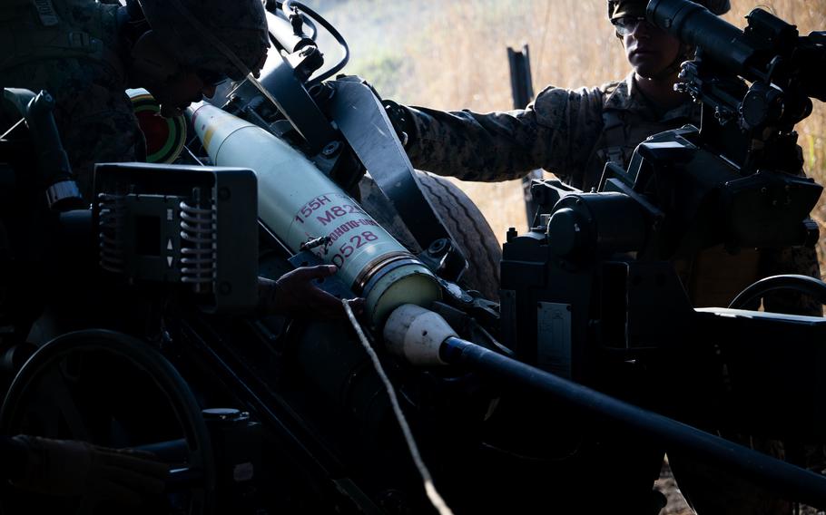 U.S. Marines load a round into a 155 mm howitzer during training in Japan on April 16, 2022. NATO Secretary-General Jens Stoltenberg is urging allies to ramp up domestic weapons production as the Russia-Ukraine war shows no signs of ending soon.