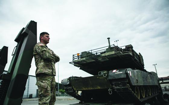 Ramstein Air Base, Germany, June 20, 2015: Sgt. 1st Class James Browning of Company C, 3rd Combined Arms Battalion, 69th Armor Regiment, watches an Air Force C-5 transport plane tax while waiting to load an M1A2 Abrams tank onto a C-17 transport plane at Ramstein Air Base in Germany. The tanks will take part in next week’s “Speed and Power” exercise at Bulgaria’s Novo Selo Training Area, meant to reassure NATO allies and demonstrate the U.S. military’s ability to rapidly deploy materiel around Europe in the wake of Russia’s annexation of Crimea from Ukraine March 2014.

Read the story on the materiel deployment here. https://www.stripes.com/theaters/europe/2015-06-20/air-force,-army-team-up-to-move-tanks-for-bulgaria-exercise-1814166.html

META TAGS: exercise; U.S. Army; 