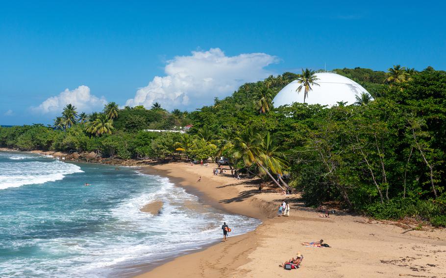 Domes Beach, named after a defunct, dome-shaped nuclear facility that dominates the skyline, is a popular surfing spot in Rincón. 