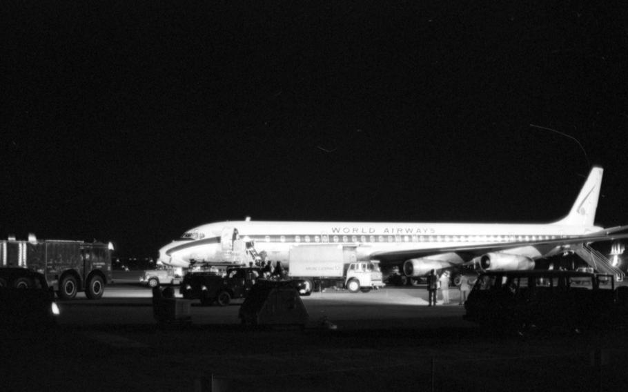 A black and white photo of an airplane on a runway.