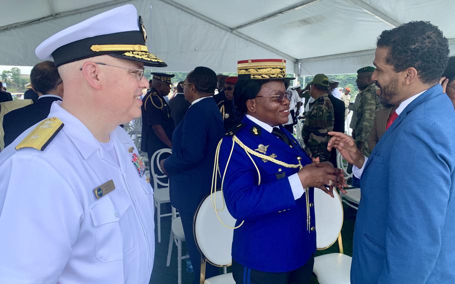 Rear Adm. Michael Mattis, left, speaks with Gabon Defense Minister Maj. Gen. Brigitte Onkanowa and David Mosby, deputy chief of mission for the U.S. Embassy in Gabon, aboard the expeditionary sea base USS Hershel "Woody" Williams on May 7, 2024. 