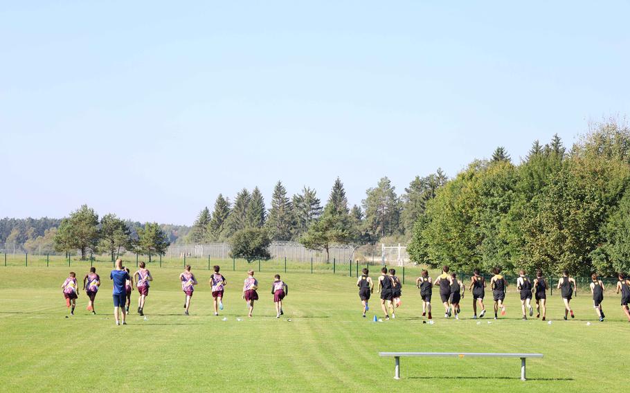 The boys from Stuttgart, Hohenfels, and Vilseck High Schools start the cross country meet at Vilseck, Germany, on Saturday, Sept. 25, 2021.