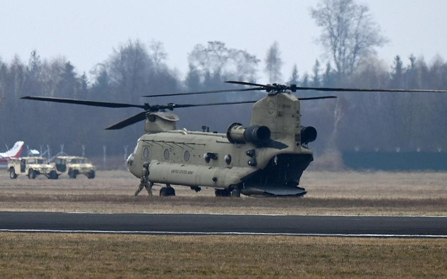A U.S. Army CH-47 Chinook helicopter sits on an airfield on the outskirts of Mielec, Poland, Feb. 26, 2022.