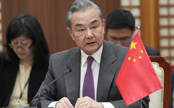 Chinese Foreign Minister Wang Yi speaks during the trilateral foreign ministers' meeting with South Korea and Japan, in Busan, South Korea, Sunday, Nov. 26, 2023. (AP Photo/Ahn Young-joon. Pool)