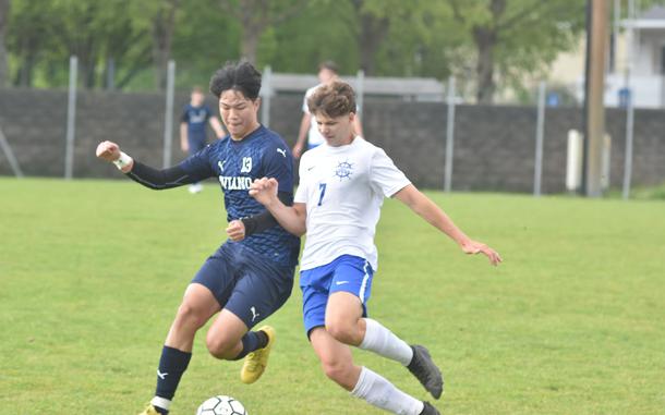 Aviano's Joseph Guerrero and Rota's Zepplin Hasselbring battle for the ball Saturday, April 27, 2024, in the Saints 3-2 victory.

Kent Harris/Stars and Stripes