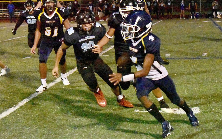 Quarterback Aaron Johnson ran 30 yards for a Guam High touchdown on a run-pass option play.