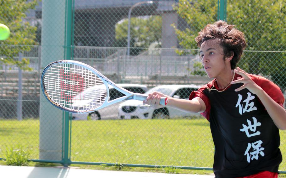 E.J. King's Antonio Diaz hits a forehand against Matthew C. Perry's Zack Cruz during Saturday's DODEA-Japan tennis matches. Diaz won 6-4.