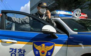 An officer responds to a call in this undated image provided by the Seoul Metropolitan Police Agency.