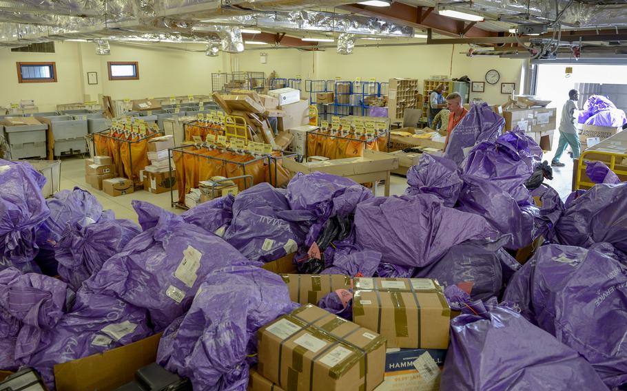 Personnel at Camp Lemonnier's post office prepare for the holiday rush of mail Dec. 12, 2019. A temporary increase to U.S. Postal Service shipping rates from Oct. 3, 2021, to Dec. 26, 2021, for the peak holiday period, will affect service members and others outside the U.S. who have military or diplomatic mailing addresses.