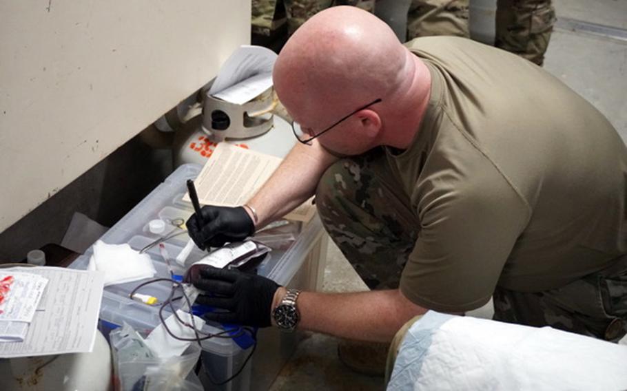 Project Lavoy medics test their new blood transfusion field kit during a casualty exercise at Kadena Air Base, Okinawa, Feb. 13, 2024.