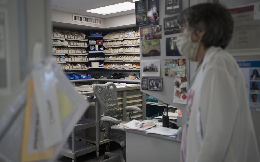 An employee enters the pharmacy area at Katherine Shaw Bethea Hospital in Dixon, Ill., on August 24, 2021.