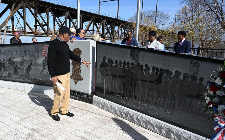 Oscar Hilton Jr., the great-great-great nephew of Sergeant Alfred B. Hilton, studies the memorial dedicated to his ancestor Sergeant Alfred B. Hilton after the unveiling of the memorial in David Craig Park in Havre de Grace Friday, November 4, 2022.