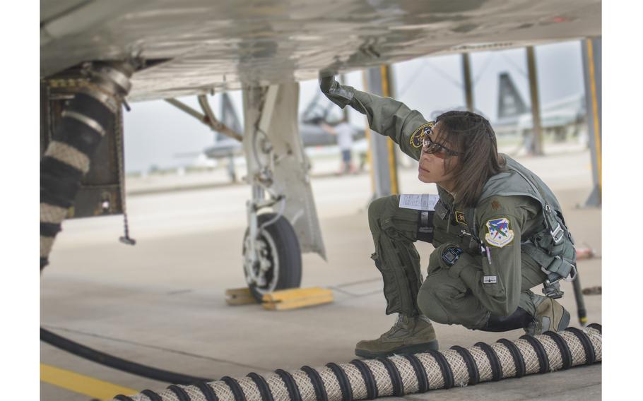 Then-Maj. Christina Hopper conducts a comprehensive check of her T-38 Talon on the flight line at Vance Air Force Base, Okla., in 2015.
