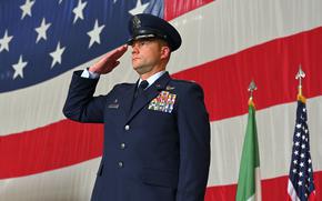 Col. Beau Diers renders his first salute as commander of the 31st Fighter Wing during the change of command ceremony at Aviano Air Base, Italy, July 11, 2025. Diers took command of the wing from Brig. Gen. Tad Clark.