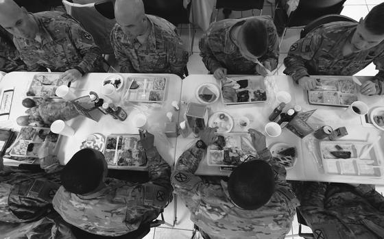 Bagram Airfield, Aghanistan, Nov. 26, 2015: American soldiers with the 10th Mountain Division eat a Thanksgiving Day meal. Commanders used the holiday to catch up and spend time with their troops.

META TAGS: U.S. Army; holiday; thanksgiving; 