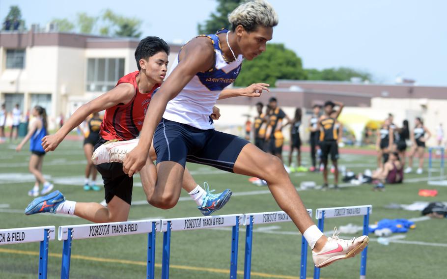 Guam High's Jayden Jackson navigates the 300-meter hurdle preliminaries.