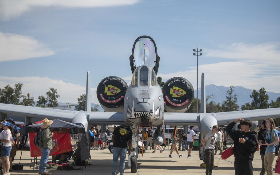 Visitors check out an A-10 Warthog on display 
