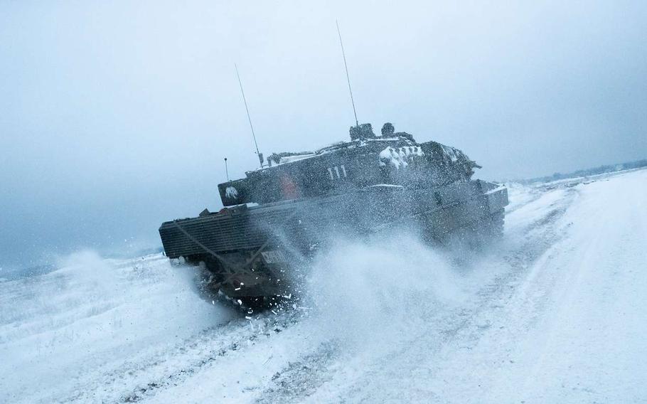 A German Leopard 2 assigned to the NATO Battlegroup Enhanced Forward Presence drives through a snowy exercise ground in Lithuania in December 2022. The German army on Sunday will take the lead of NATO’s quick reaction force, a unit that earlier this year was activated for the first time in its history in the aftermath of Russia’s full-scale war on Ukraine.