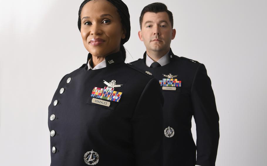 Guardians Lt. Col. Alison Gonzalez, left, and Maj. Dylan Caudill wear the U.S. Space Forces Service Dress prototype before its unveiling during the Air Force Associations Air, Space and Cyber Conference at National Harbor, Md., Sept. 21, 2021. The uniform has since been completely redesigned, service officials said.