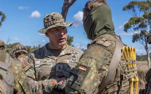 Army Maj. Gen. Joseph Ryan interacts with a fellow participant in exercise Talisman Sabre in Townsville, Australia, on Aug. 1, 2023. Now a lieutenant general, Ryan warned in a speech at a conference of the Association of the U.S. Army on March 25, 2025, that the service is "so far behind" in adapting to the use of new fiber-optic drones.