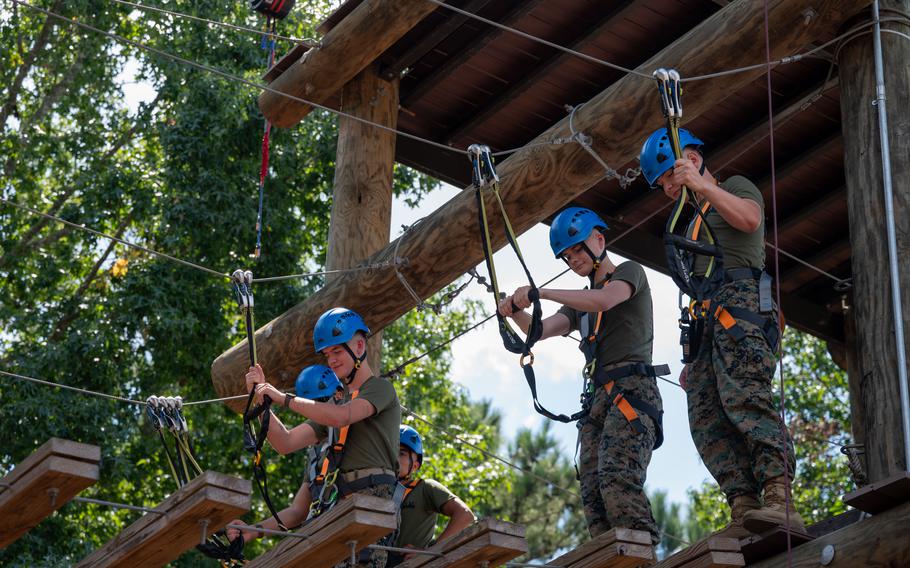 Marines participate in a confidence course.