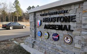 A gate reading “UNITED STATES ARMY/REDSTONE ARSENAL.”