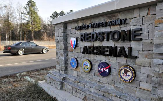 A gate reading “UNITED STATES ARMY/REDSTONE ARSENAL.”