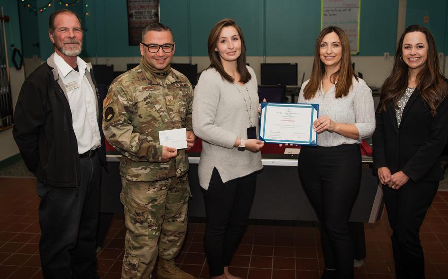 Tech. Sgt. Salvador Gutierrez and his wife Eden (second and third from left) received the Boys and Girls Clubs of America Military Family of the Year for the U.S. Air Force award on Dec. 13, 2021.