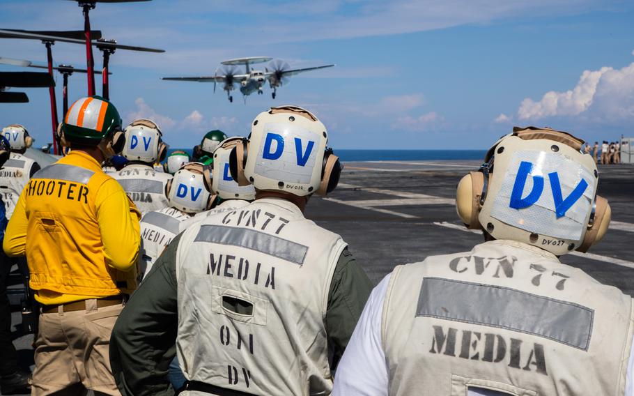 Distinguished visitors observe flight deck operations aboard Nimitz-class aircraft carrier USS George Washington (CVN 73) in the Atlantic Ocean, Sept. 13, 2023.